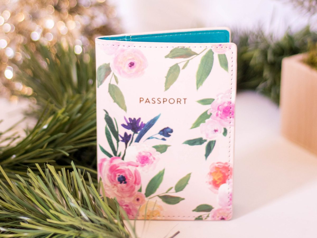 Floral passport cover is one of the travel essentials for women.