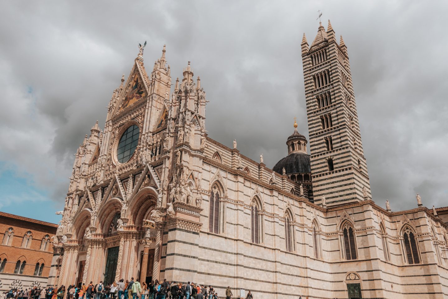 Siena cathedral with marble facade and tower