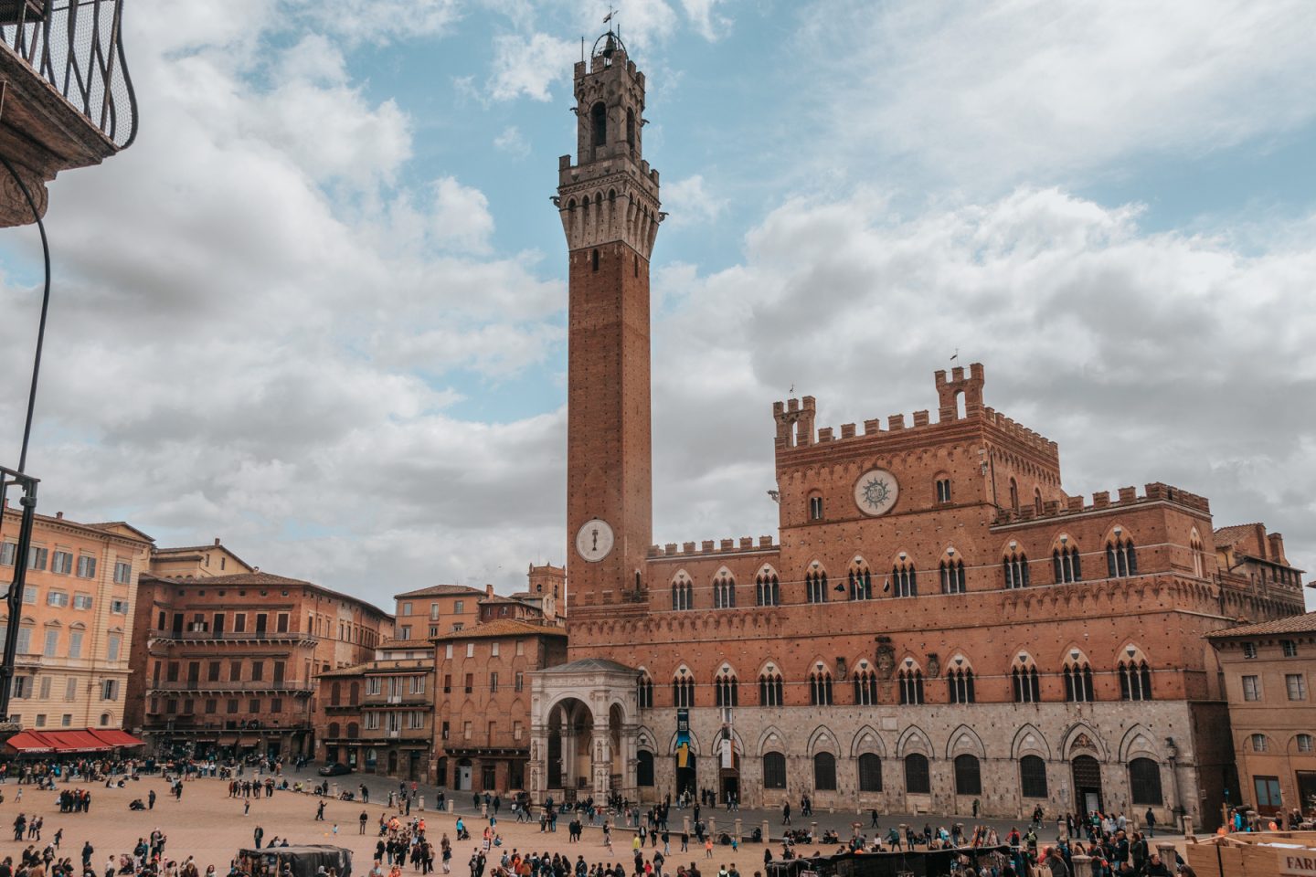 Medieval building and tower in Siena city center